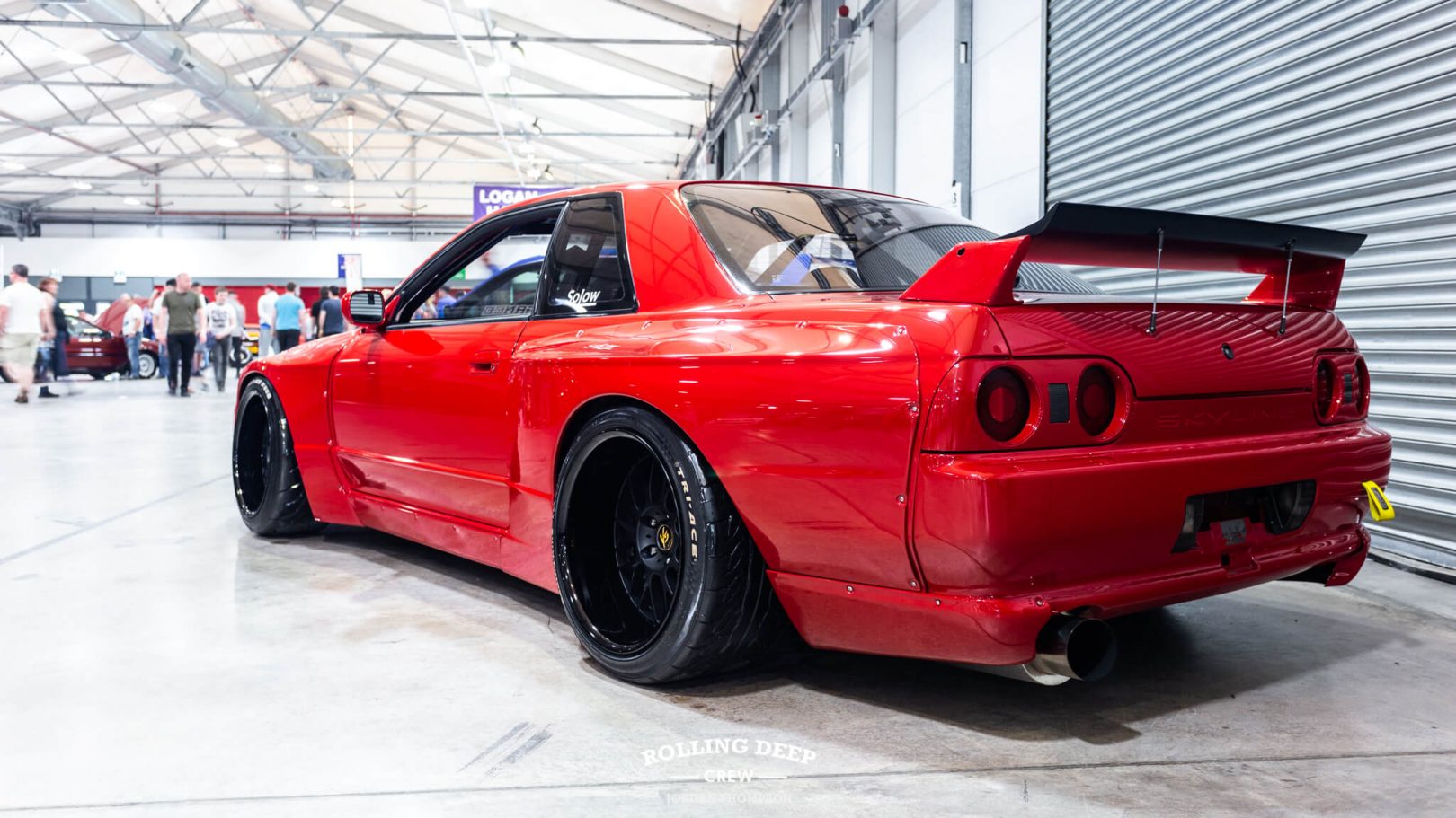 One of the stand out cars for us was a red Nissan R32 with a Pandem wide bo...
